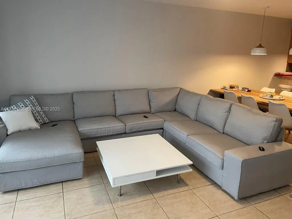 Large living room fits huge sectionals with plenty of space for everyone
